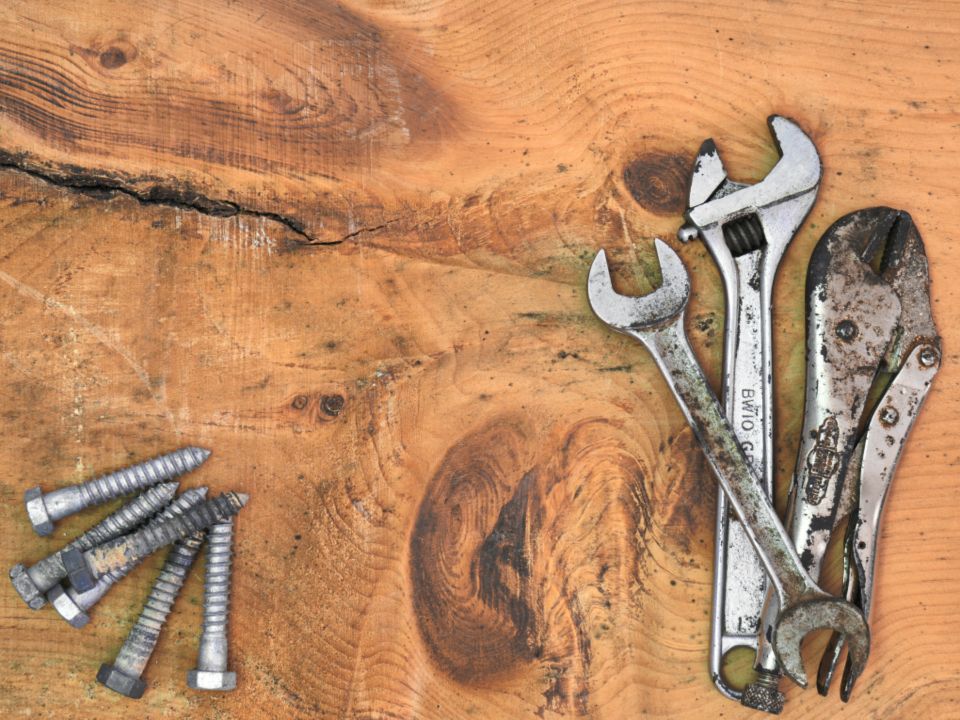 Wrenches and bolts on wood